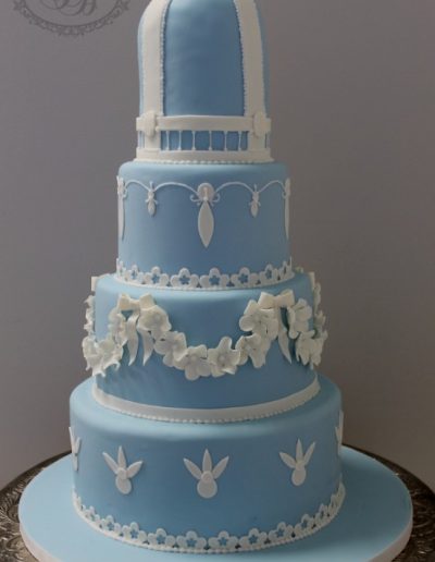 4 tier blue wedding cake with floral details