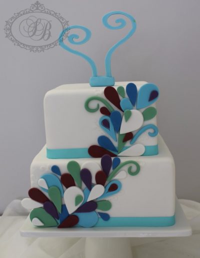 Colourful peacock inspired square wedding cake
