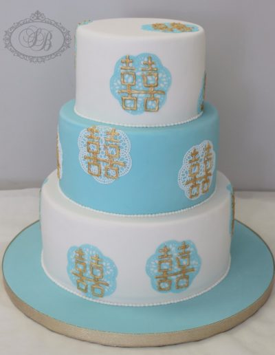 Blue, white and gold double happiness lace wedding cake