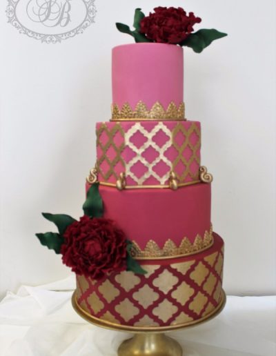 Deep pink and gold Moroccan themed wedding cake
