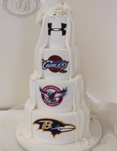 Wedding cake with exposed back showing sporting logos