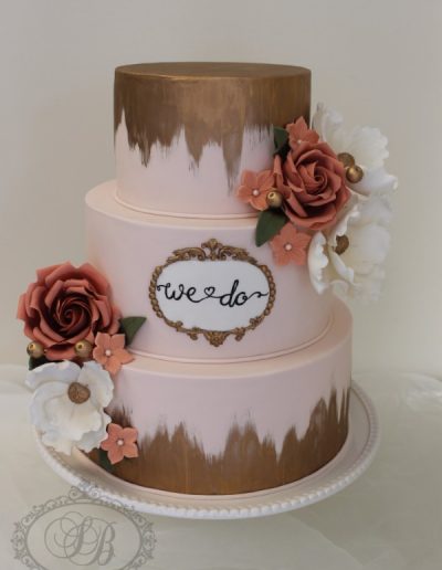 Pink wedding cake with copper paint fade and vintage sugar flowers