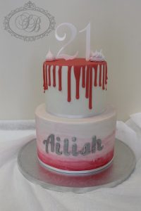2 tier pink drip and watercolour cake with meringues