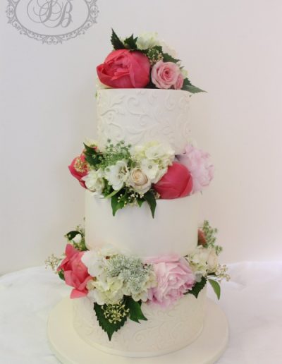 Fresh flower blocked 3 tier wedding cake with damask