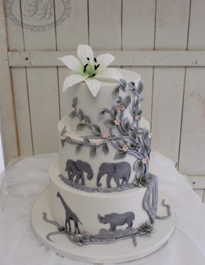 Silver painted tree and jungle animal wedding cake