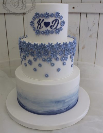 Periwinkle blue blossom fade and watercolour wedding cake