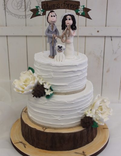 Rough royal wedding cake with realistic log tier and sugar flowers