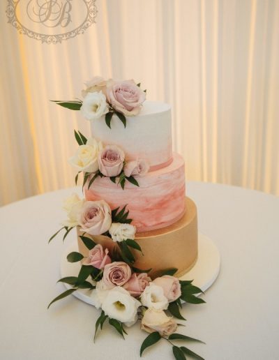 Peach ombre watercolour wedding cake with gold