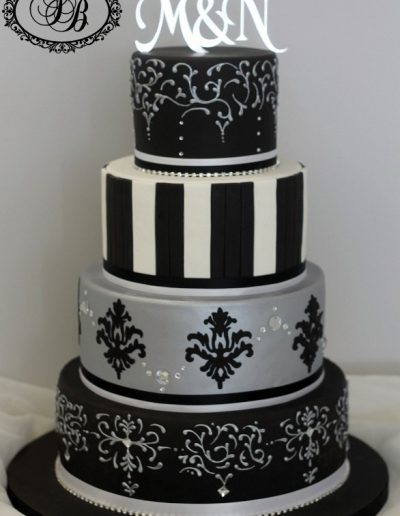 Detailed black, silver and white 4 tier wedding cake