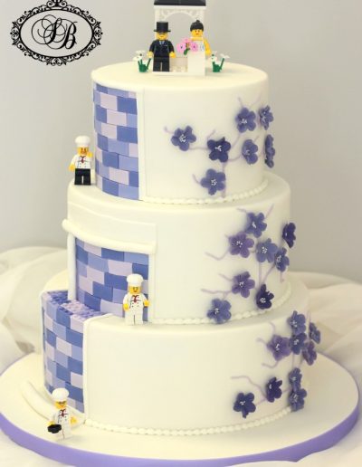 Purple 3 tier lego wedding cake with blossoms