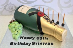 3D champagne bottle cake with grapes