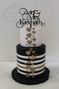 Pink, gold and stripes wedding cake