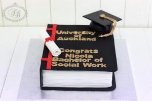 Graduation book cake with cap