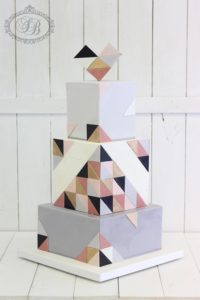 Square 3 tier wedding cake with geometric detailing