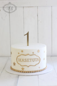 Simple gold and white 1st birthday cake