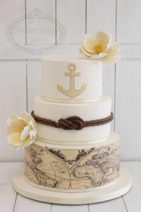 Nautical themed wedding cake with world map