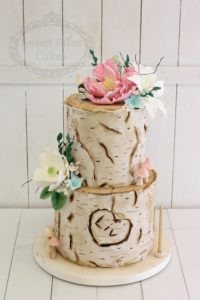 Log effect cake with sugar flowers
