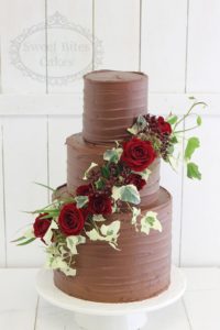 Chocolate ganache finish wedding cake with red roses