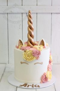 Pink and yellow unicorn cake