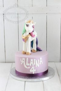 Purple unicorn figurine cake