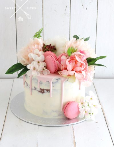semi naked flowers pink drip cake
