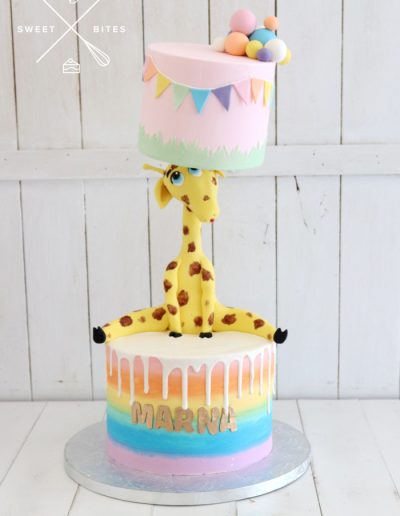 giraffe rainbow colourful balancing cake