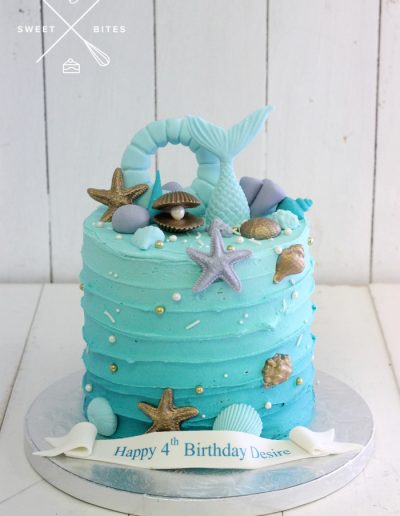 blue ombre under the sea mermaid shell cake