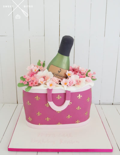 designer handbag pink wine bottle cake