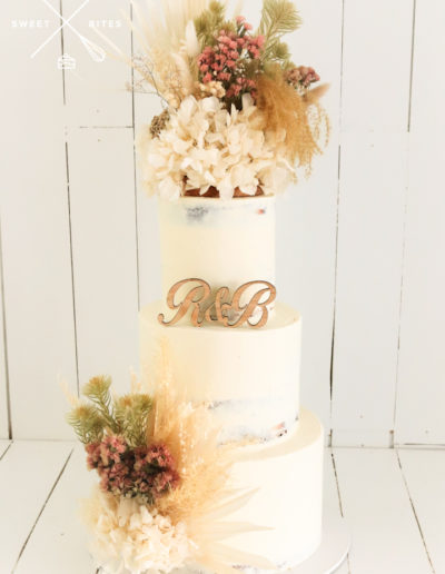 semi naked wedding cake rustic flowers boho country