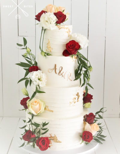 4 tier linear texture wedding cake roses gold initials