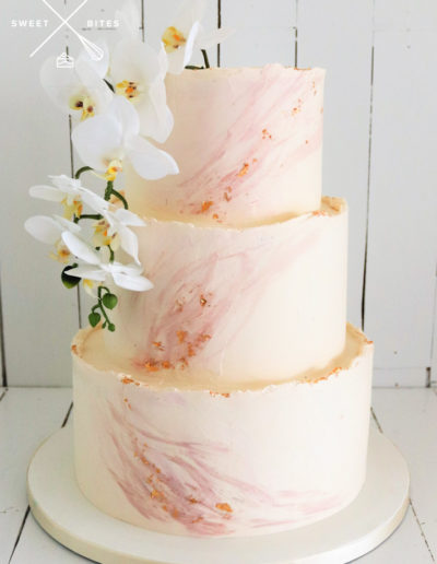 marble painted pink swish cake wedding orchids