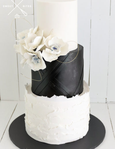black white wedding cake blue orchid sugar flowers geometric layered texture