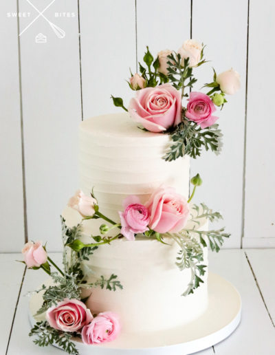 2 tier linear texture wedding cake pink roses