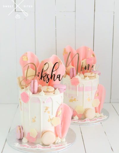 cakes gold mirror topper pink white watercolour drip gold macarons pink sails chocolate hexagons