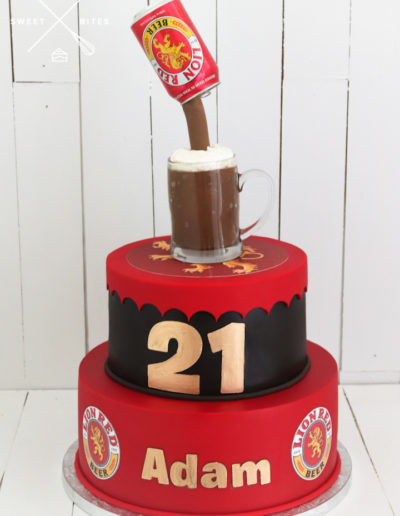 lion red beer 2 tier cake can pouring into cup mug bottle cap