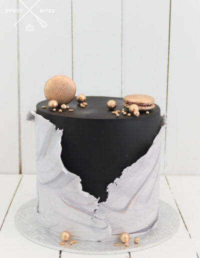 black cake white and grey marble wrap gold macarons